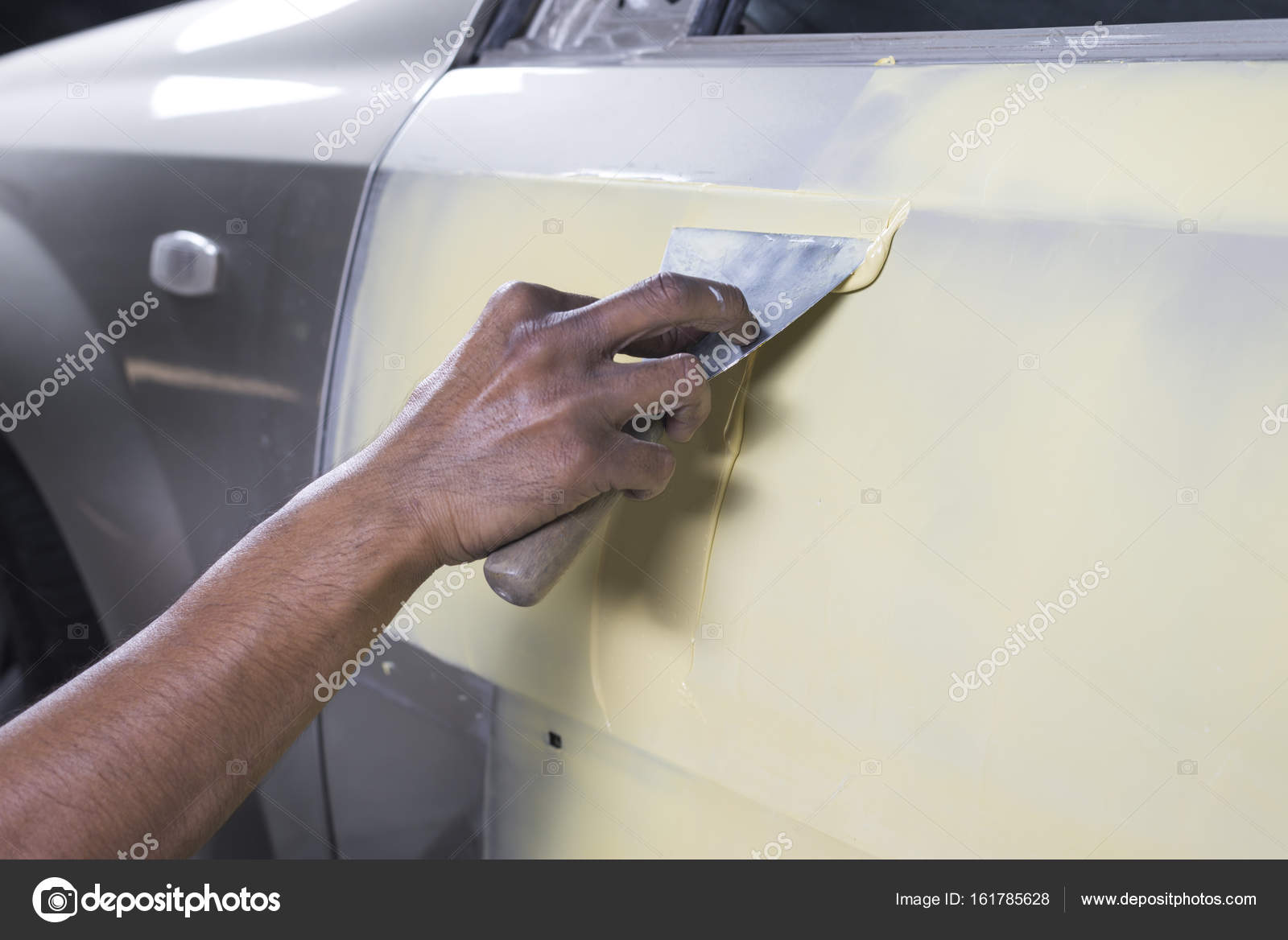 Auto body repair series: Working on putty Stock Photo by ©kunksy.gmail.com  161785628